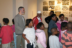 Mariconti and the children at the exhibition opening