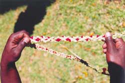 Detail of Woven Grass with Red Ribbon